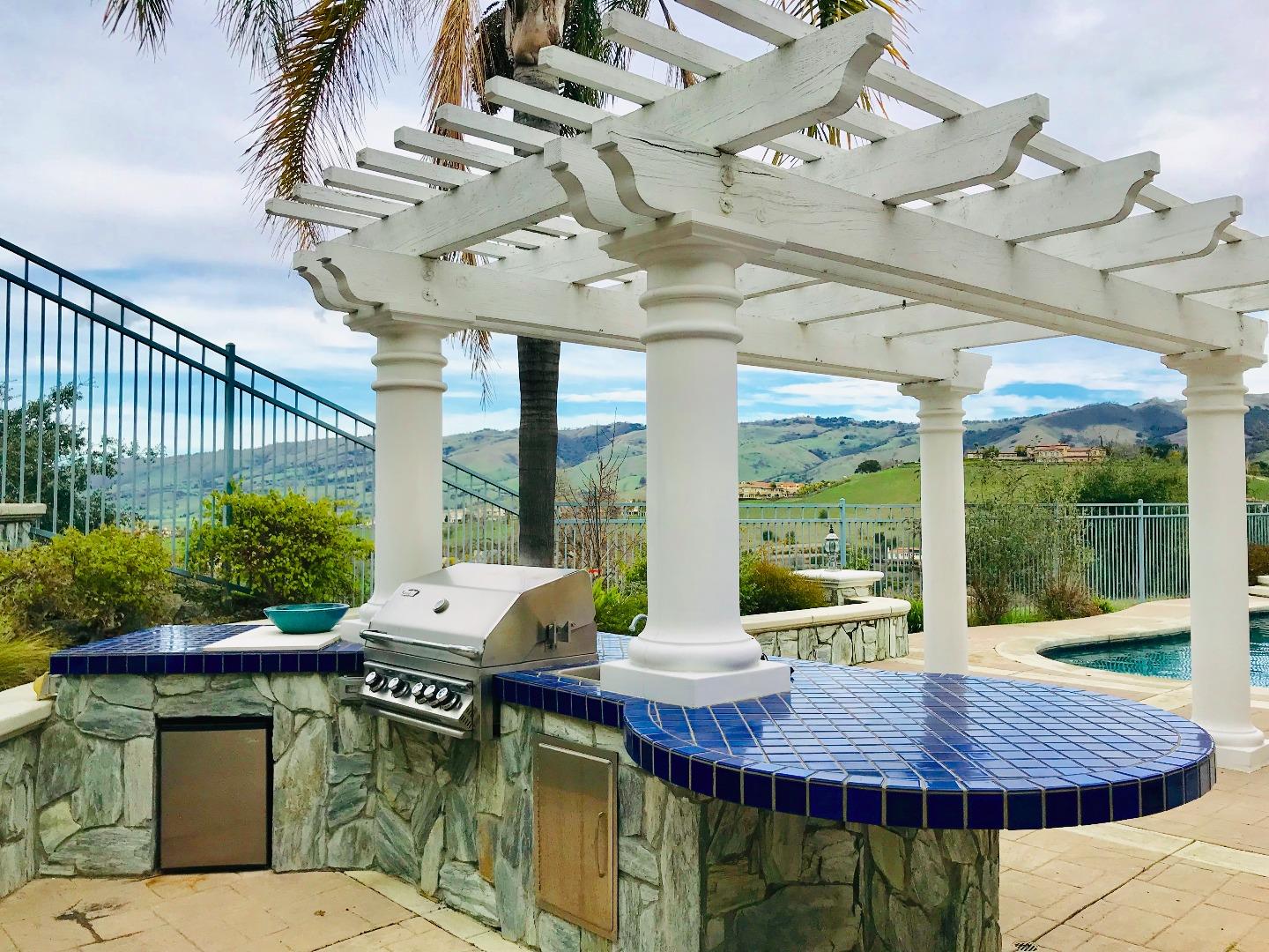 Foligno Way San Jose, CA 95138 - Photo 18 of 22 a view of a patio with a table chairs and a small yard