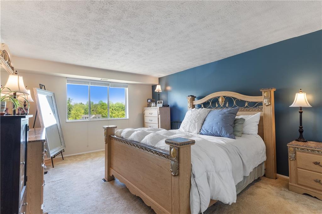 329 Ridge Point Circle, Unit 33 Bridgeville, PA 15017 - Photo 14 of 32 a bedroom with bed and window