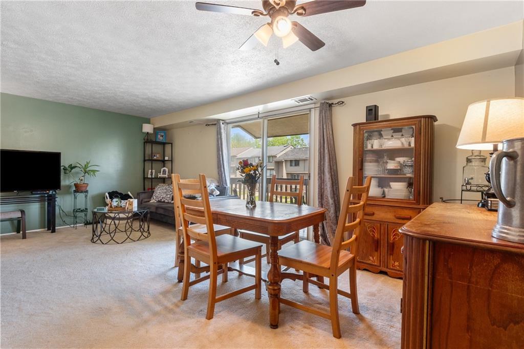 329 Ridge Point Circle, Unit 33 Bridgeville, PA 15017 - Photo 8 of 32 a dining room with furniture and window
