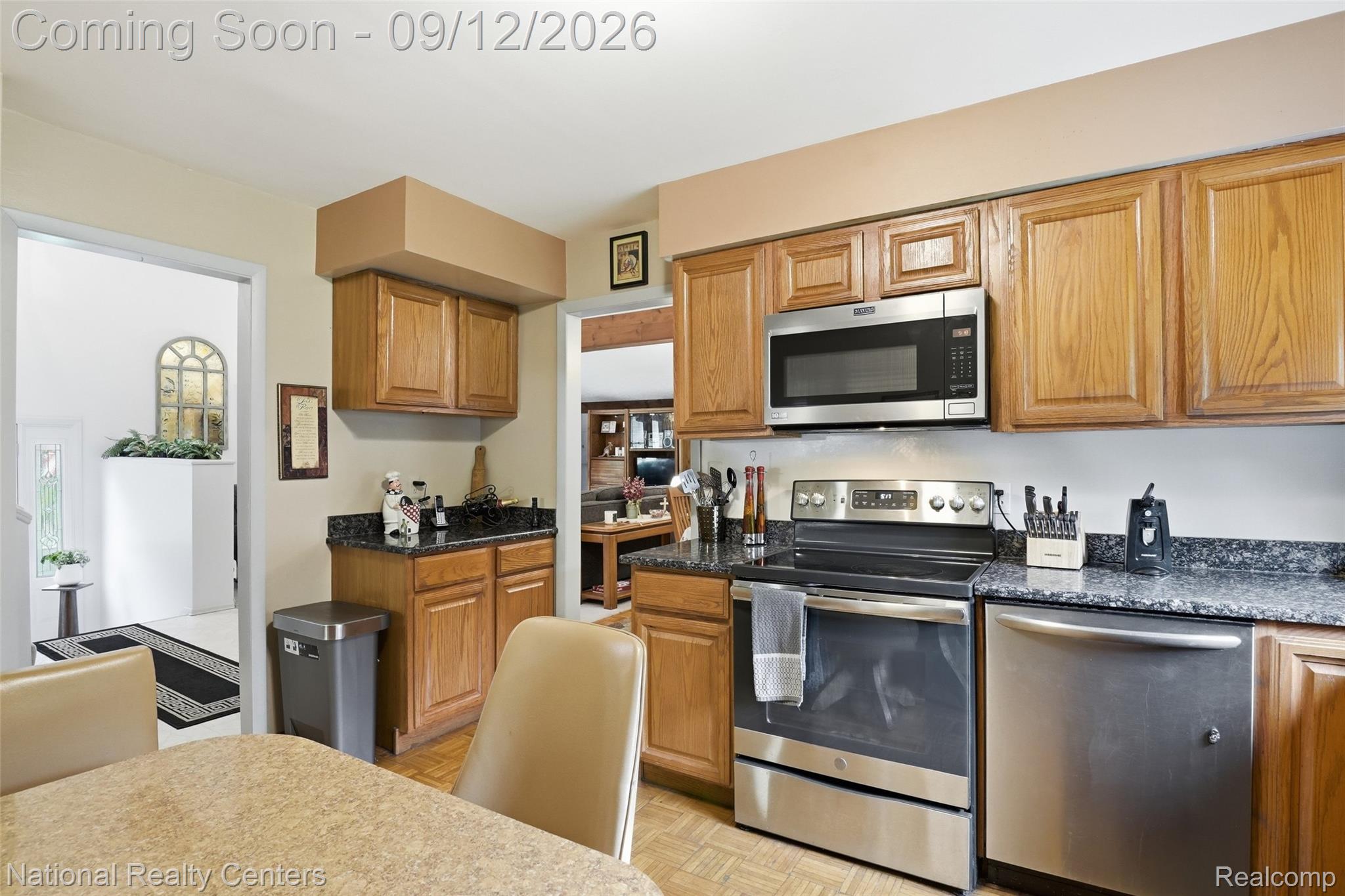 2631 Garden Road Milford, MI 48381 - Photo 21 of 40 Wood-finish cabinetry paired with dark speckled countertops