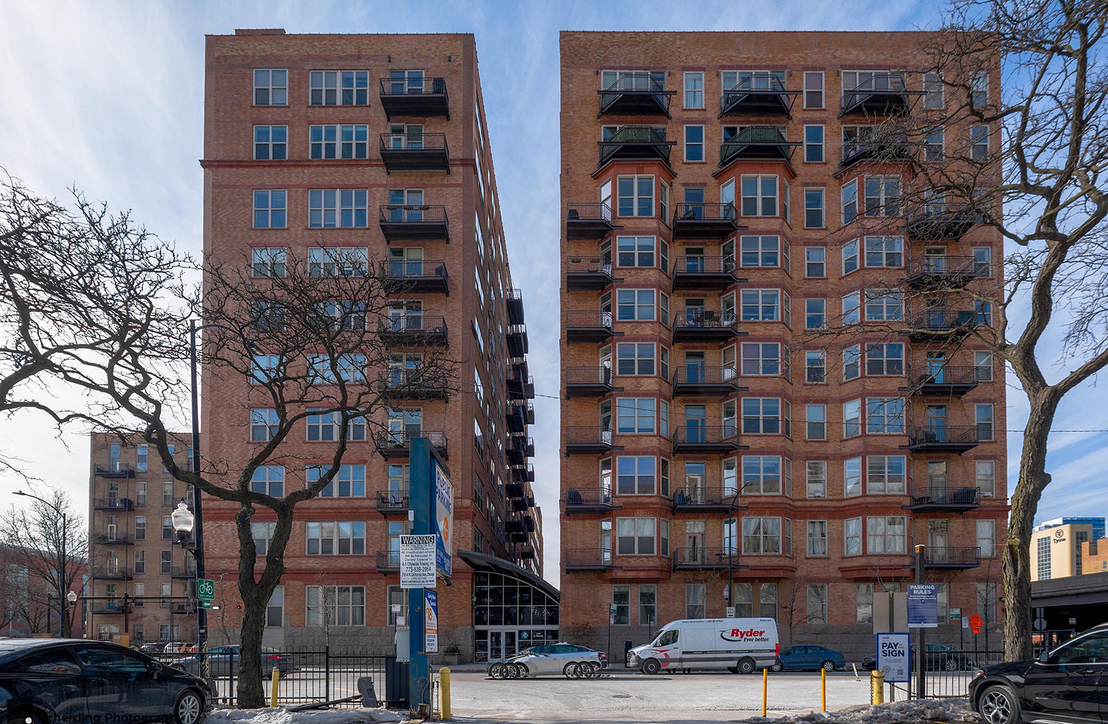 500 South Clinton Street, Unit 130 Chicago, IL 60607 - Photo 1 of 17 a front view of a building with lot of windows and trees