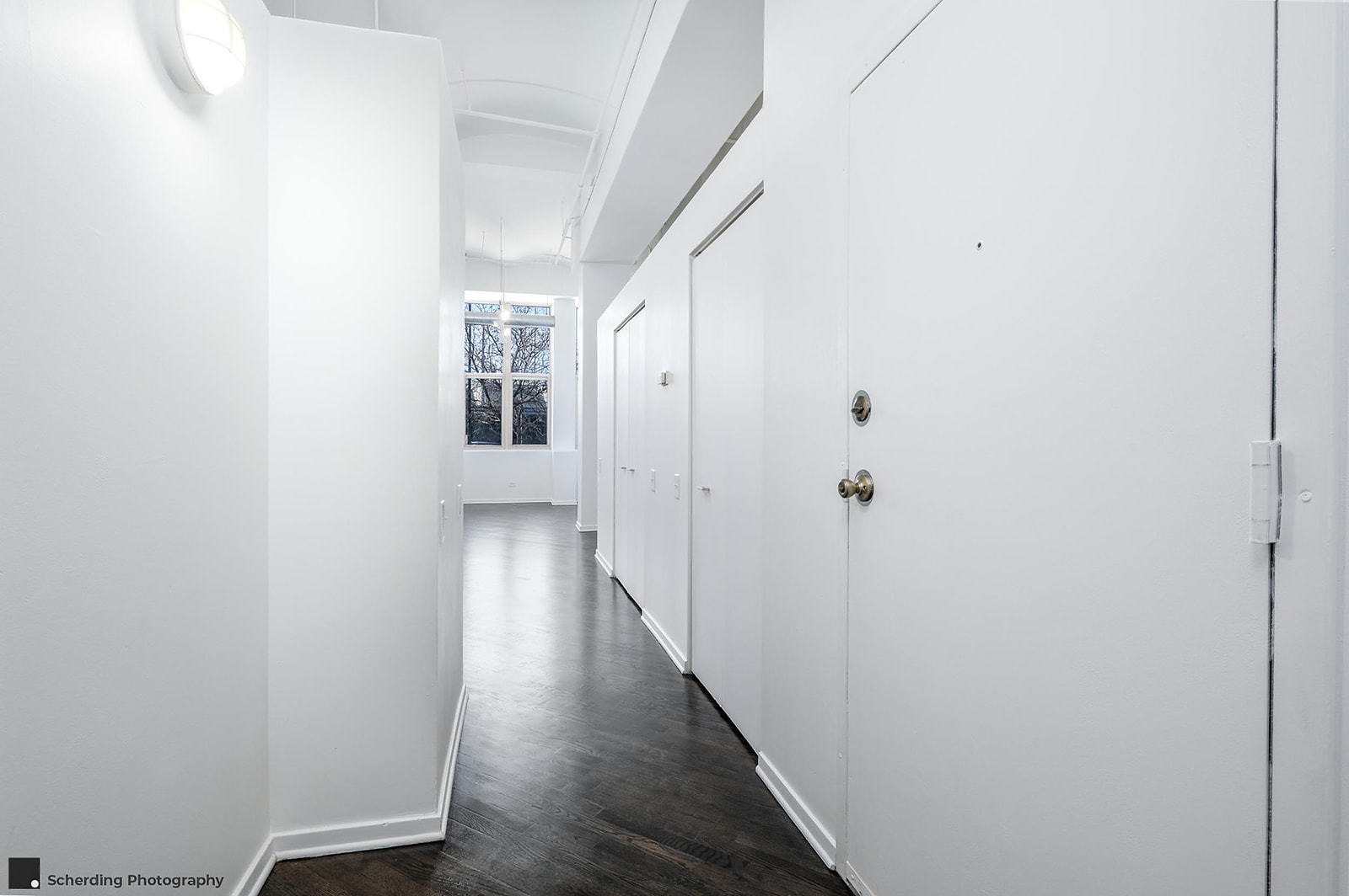500 South Clinton Street, Unit 130 Chicago, IL 60607 - Photo 3 of 17 a view of a hallway with wooden floor