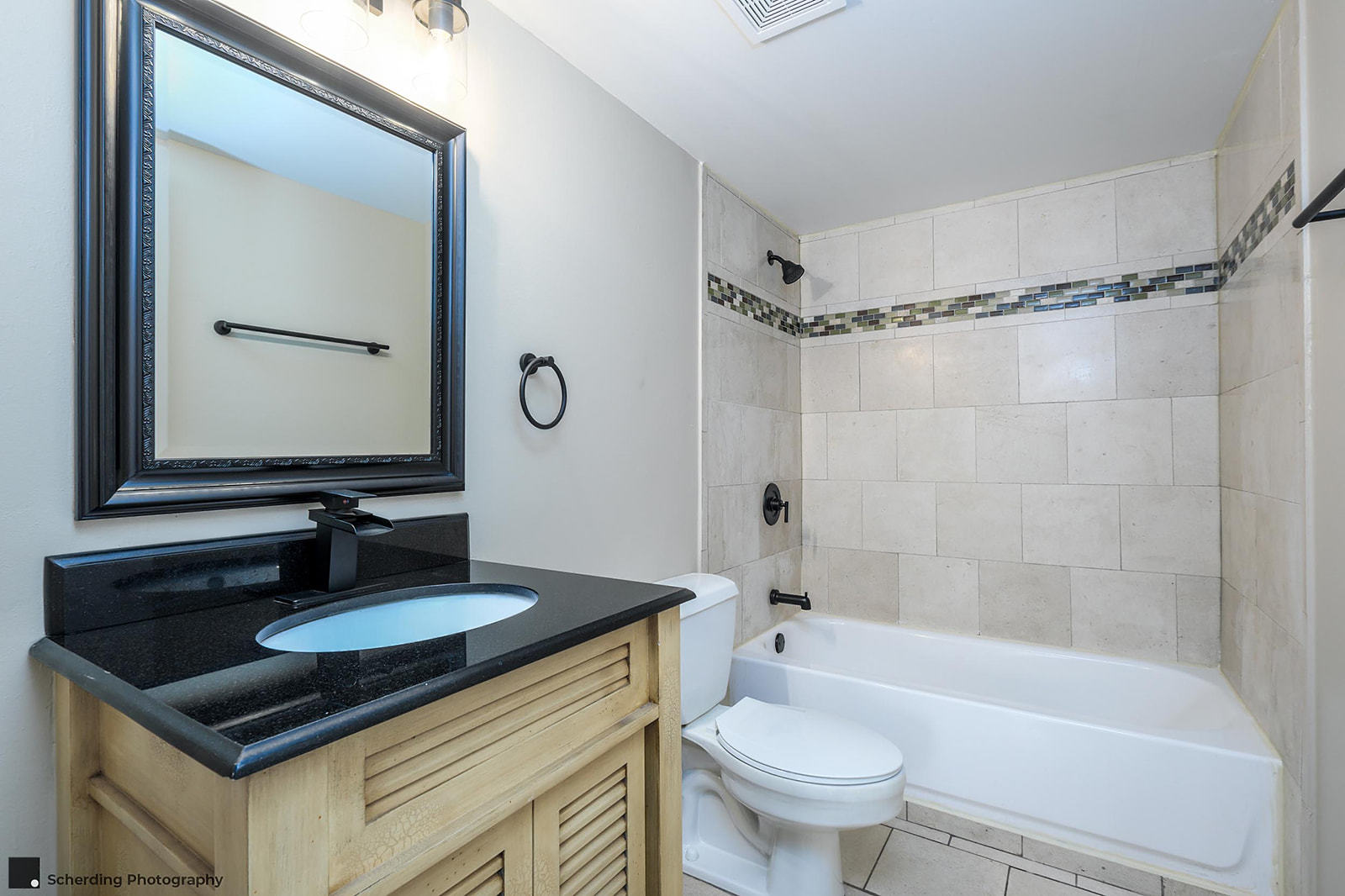 500 South Clinton Street, Unit 130 Chicago, IL 60607 - Photo 10 of 17 a bathroom with a granite countertop sink toilet mirror and shower
