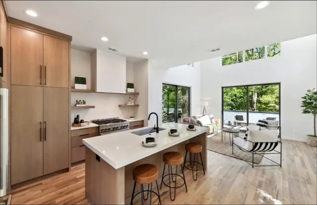 a kitchen with a table chairs stove and microwave