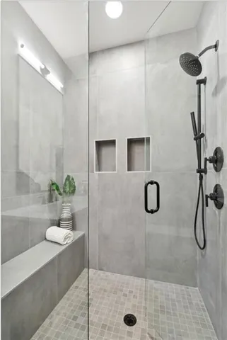 a view of an empty room and wooden floor