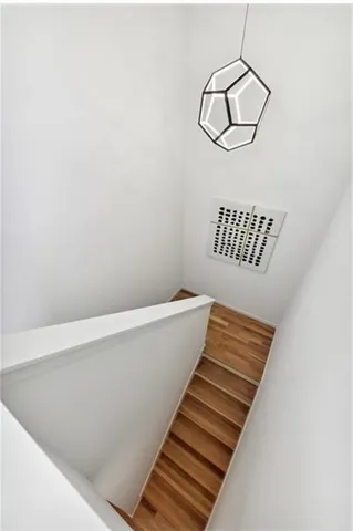 a view of an outdoor sitting area in a backyard