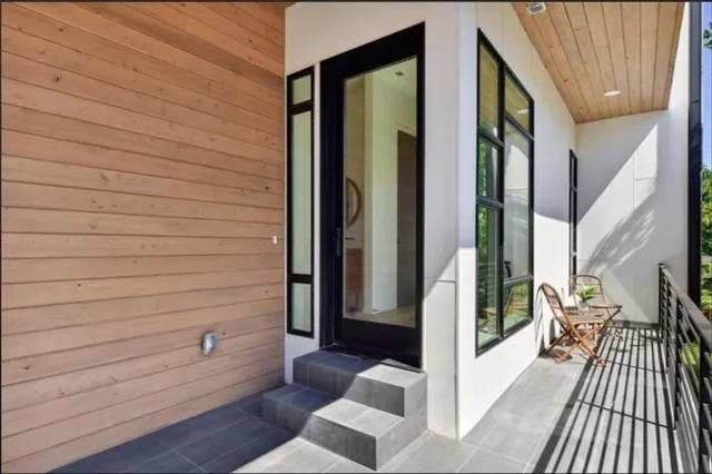a view of hallway with wooden floor