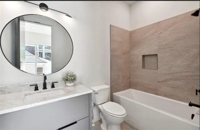a kitchen with granite countertop a sink and stainless steel appliances