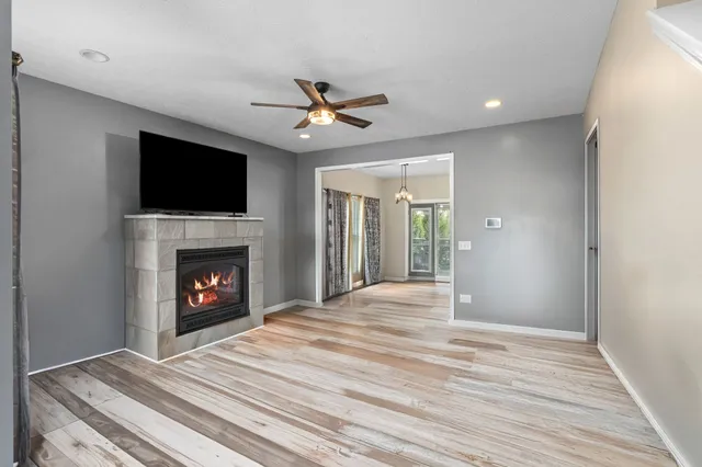 a view of an empty room with a fireplace