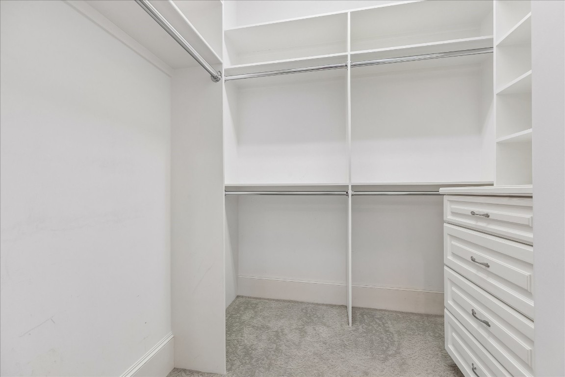 4022 Coleridge Street Houston, TX 77005 - Photo 16 of 31 Walk-in closet to junior suite on first floor. Lots of built-in cabinetry and storage space.