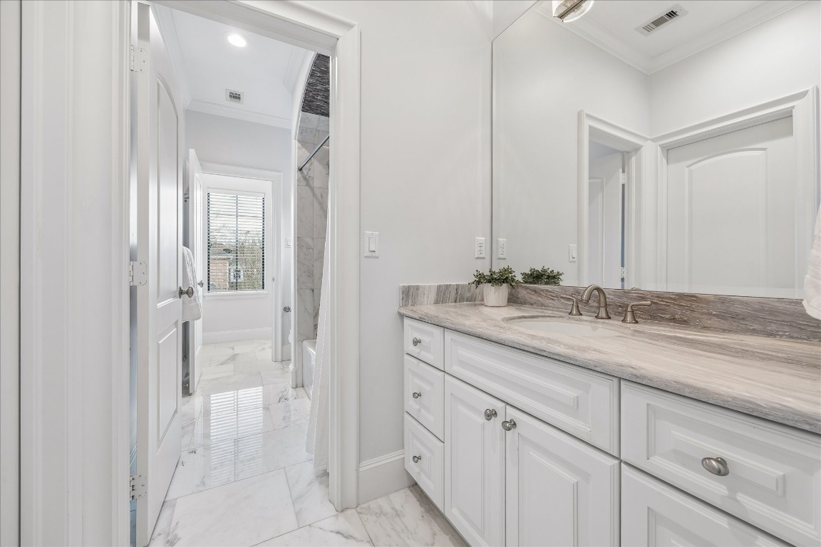 4022 Coleridge Street Houston, TX 77005 - Photo 20 of 31 Connected secondary bathroom with stone countertops, beautiful tile, walk-in closet, and lots of storage.