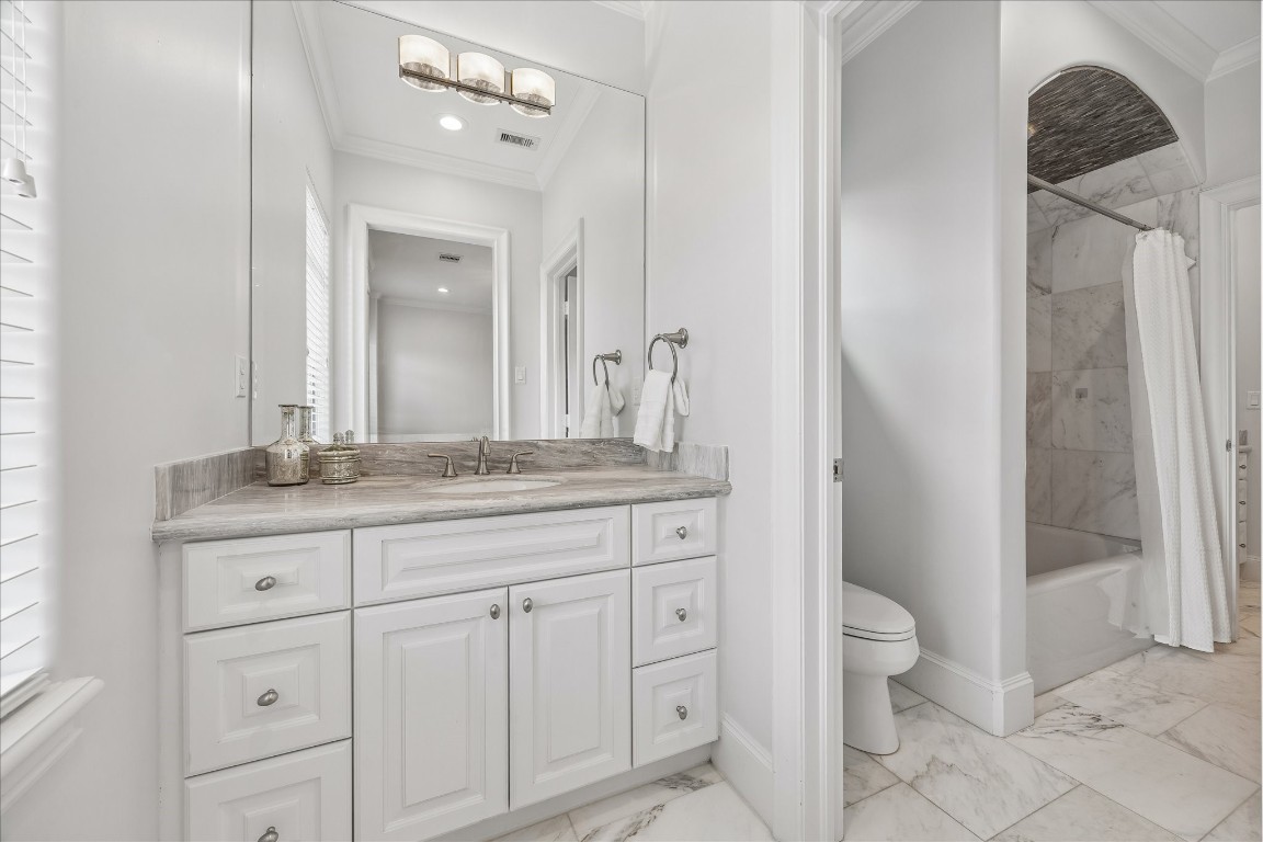 4022 Coleridge Street Houston, TX 77005 - Photo 23 of 31 Secondary bathroom showcasing beautiful tile flooring, elegant vanity, and tub/shower combination with designer tile.