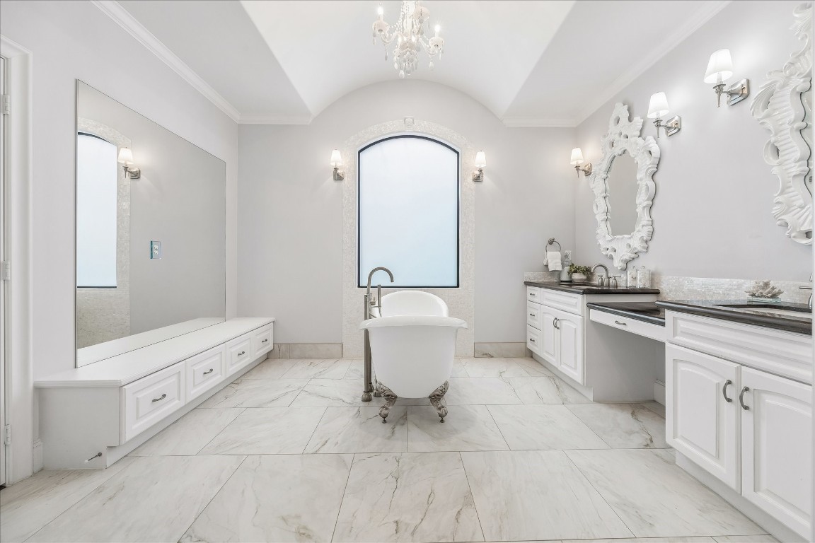 4022 Coleridge Street Houston, TX 77005 - Photo 27 of 31 Spa-inspired primary bath with freestanding soaking tub, double vanities, and elegant finishes.