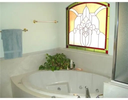 a bathroom with a bathtub and a window