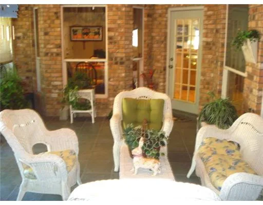 a view of swimming pool with a table and chairs