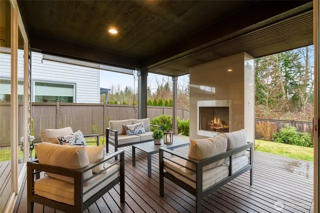 a outdoor living space with furniture and a fireplace