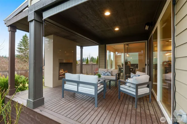 a living room with large windows and furniture
