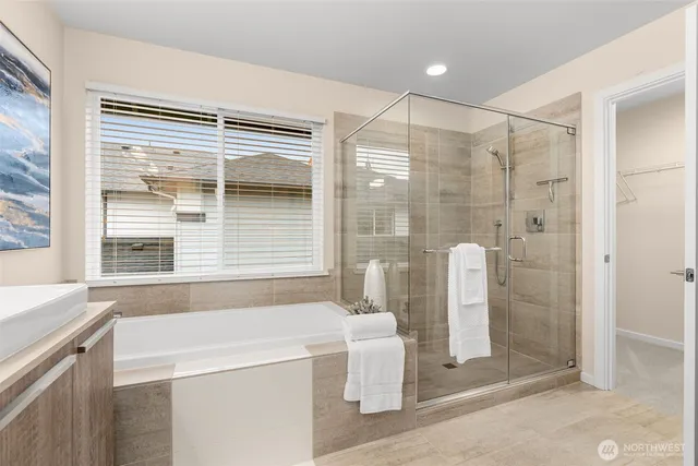 a bathroom with a shower and a sink