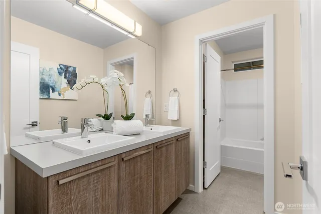 a bathroom with a sink and a mirror