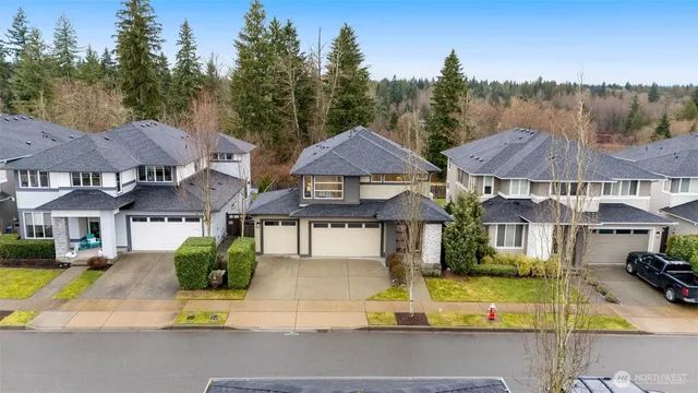 a view of house with garden space and swimming pool