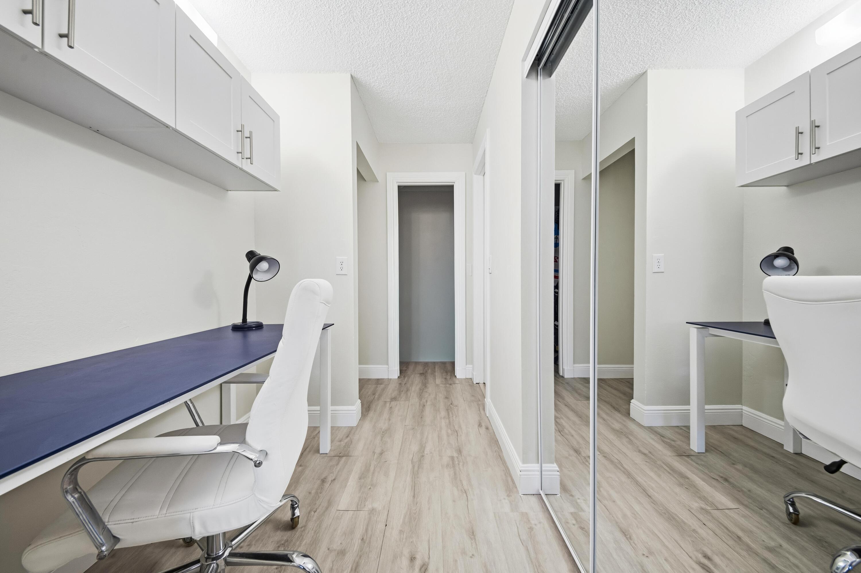 9440 Southwest 8th Street, Unit 314 Boca Raton, FL 33428 - Photo 13 of 30 a view of a room with wooden floor lounge chair and windows