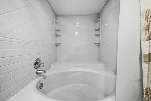 a close up of a bathtub in a bathroom