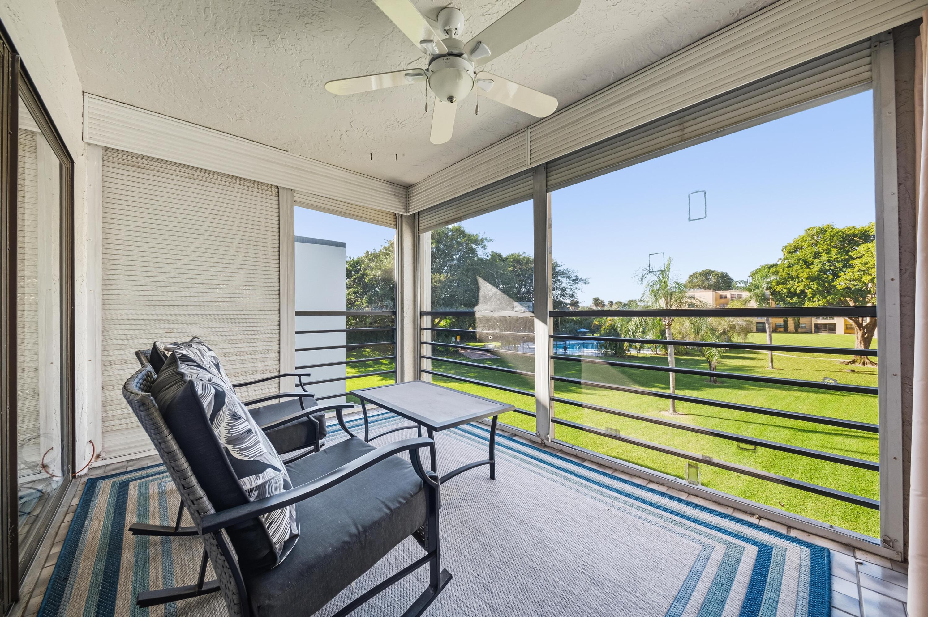 9440 Southwest 8th Street, Unit 314 Boca Raton, FL 33428 - Photo 21 of 30 a view of a chairs and table in the balcony