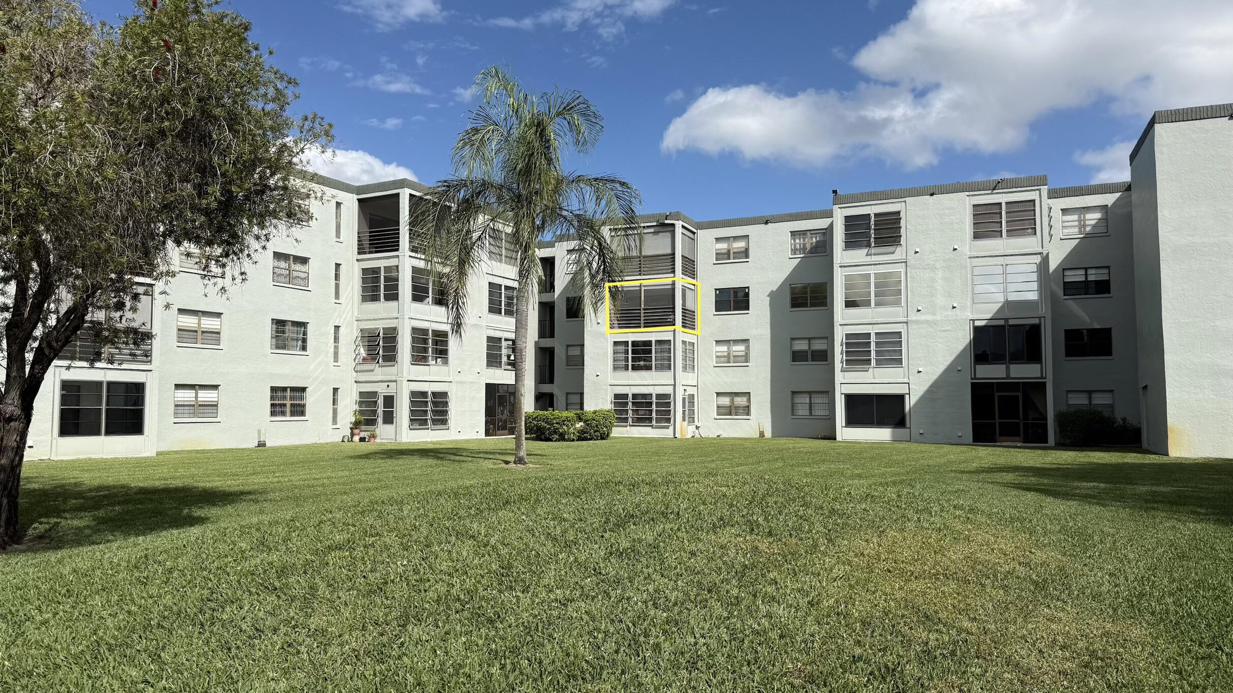 9440 Southwest 8th Street, Unit 314 Boca Raton, FL 33428 - Photo 24 of 30 a view of building with yard