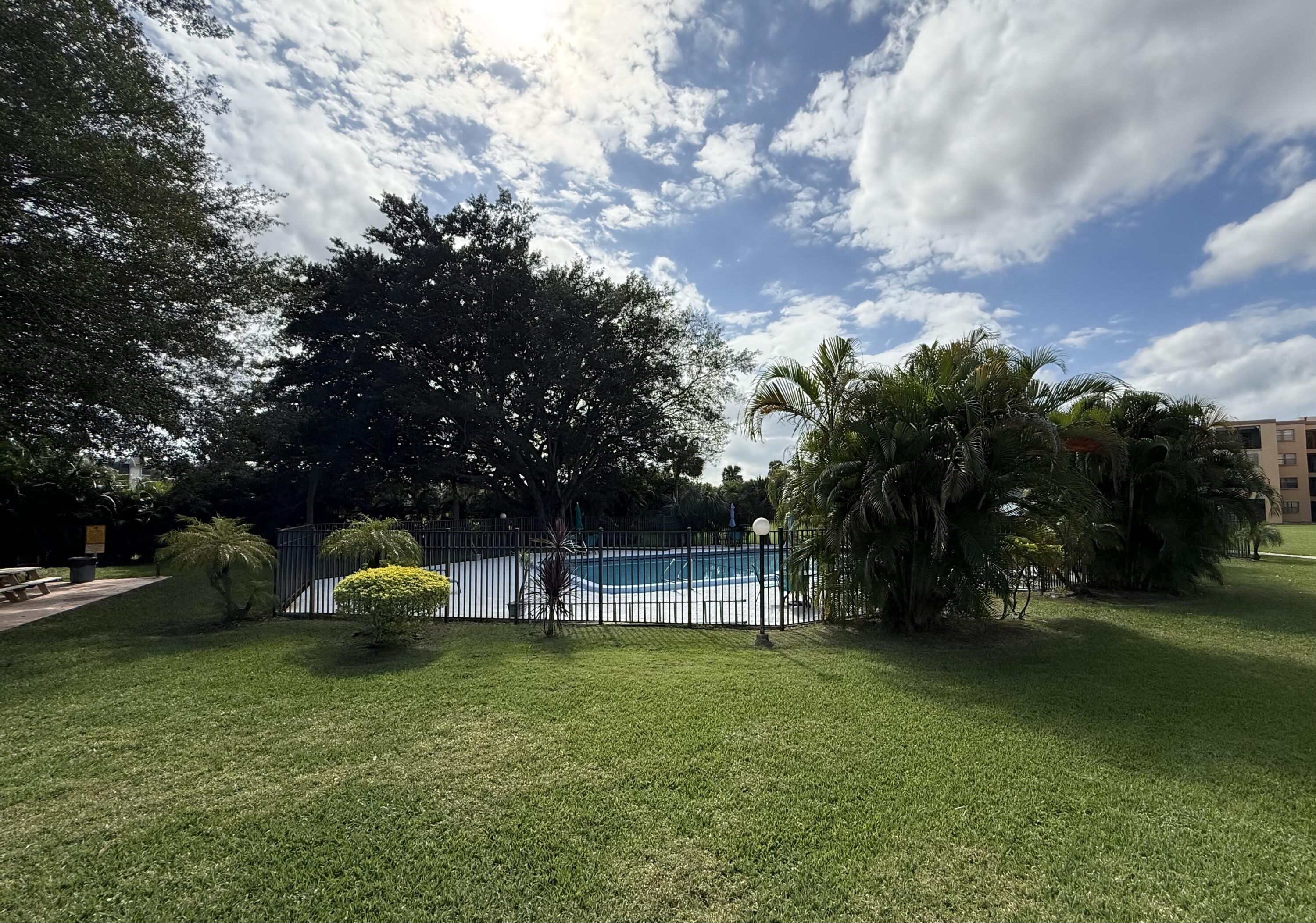 9440 Southwest 8th Street, Unit 314 Boca Raton, FL 33428 - Photo 26 of 30 a view of a park with large trees