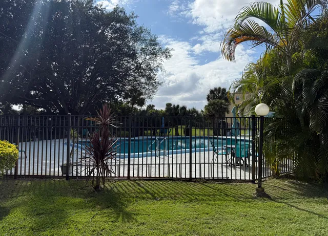a view of a wrought iron fences in front of house