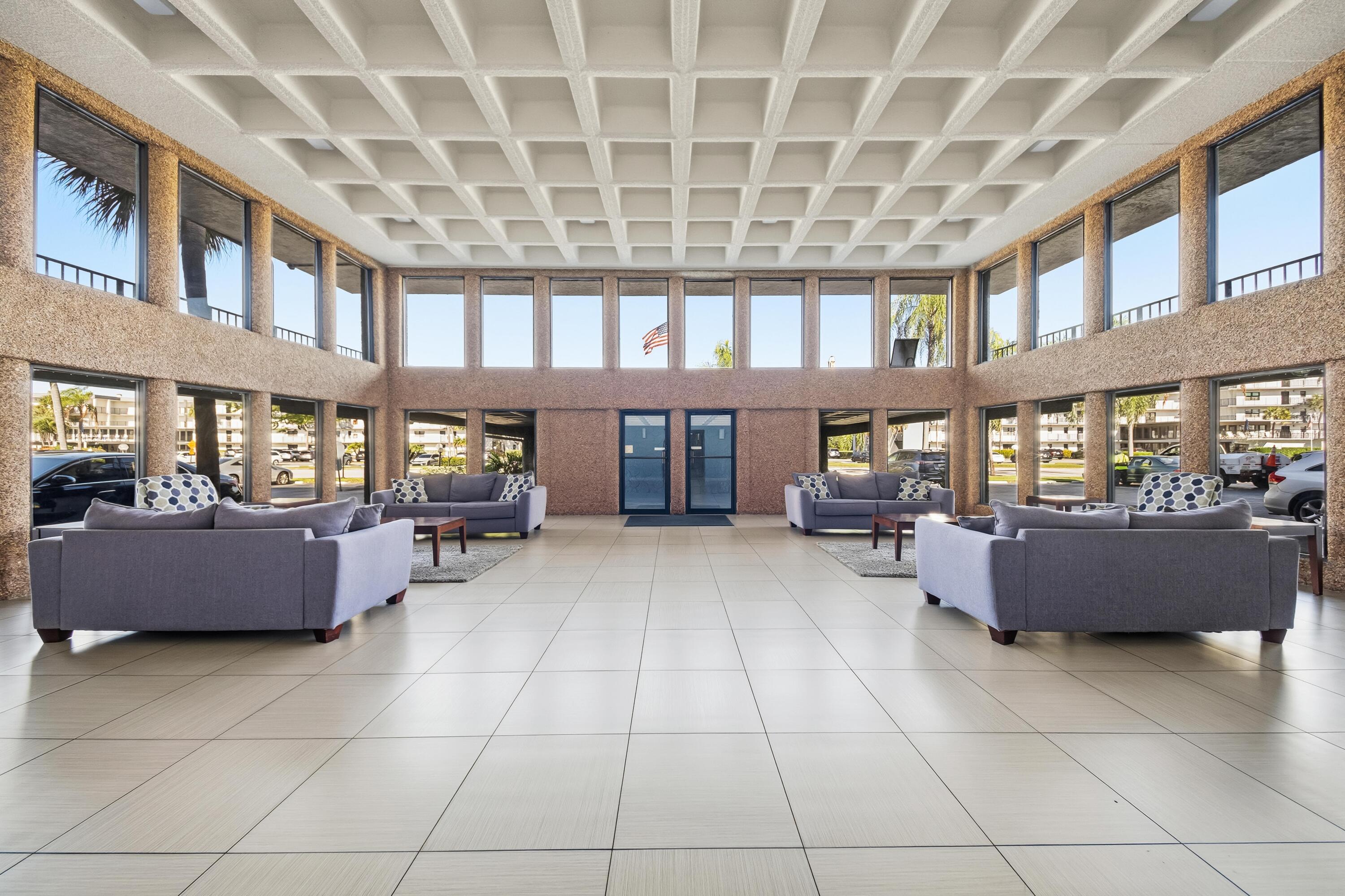 9440 Southwest 8th Street, Unit 314 Boca Raton, FL 33428 - Photo 30 of 30 a living room with furniture and a window
