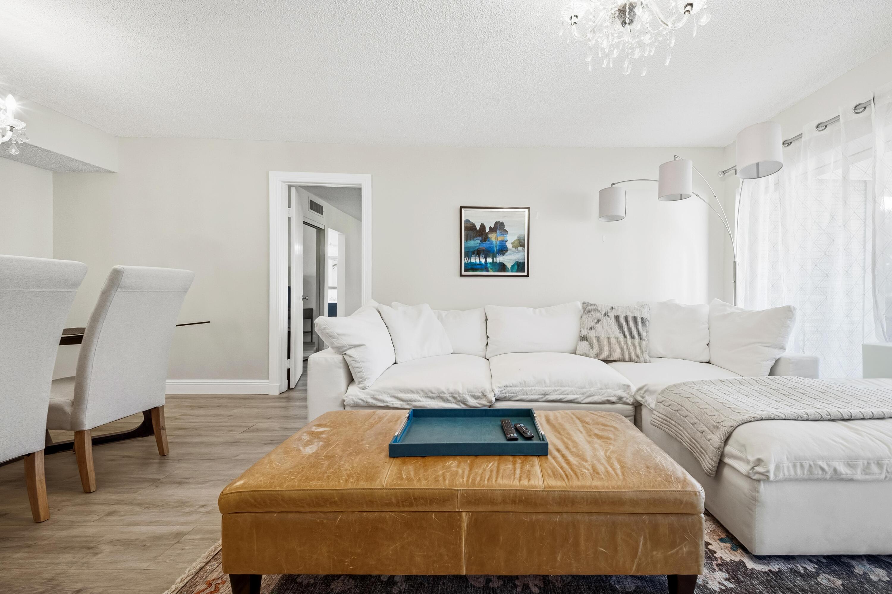 9440 Southwest 8th Street, Unit 314 Boca Raton, FL 33428 - Photo 9 of 30 a bedroom with a large bed and a couch