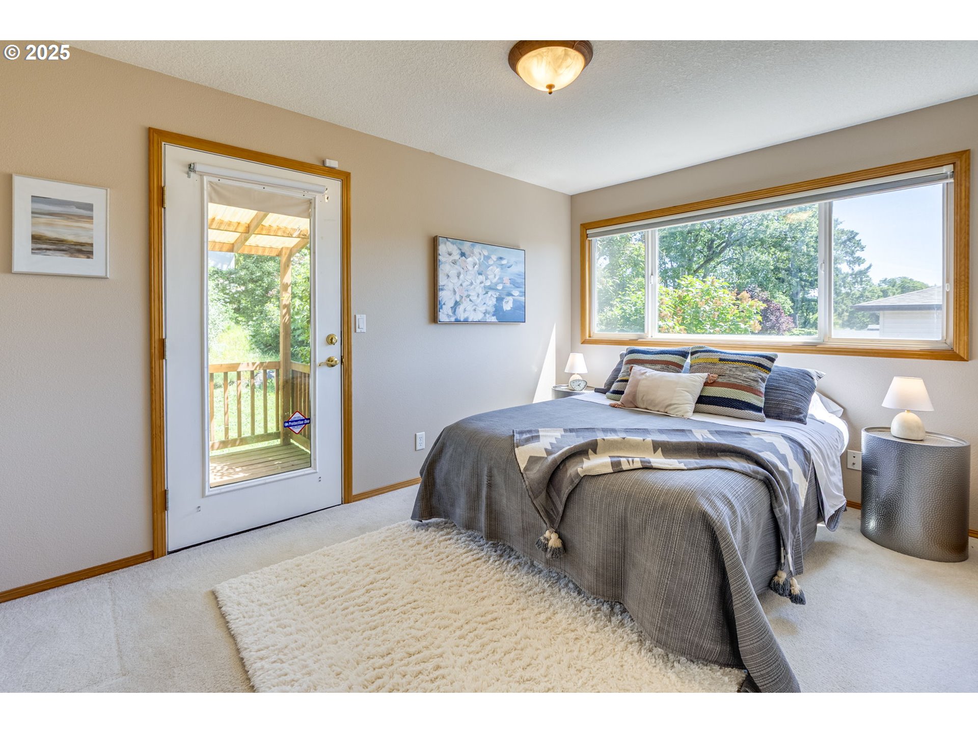 985 Cornell Avenue Gladstone, OR 97027 - Photo 22 of 38 a bed sitting in a bedroom next to a window