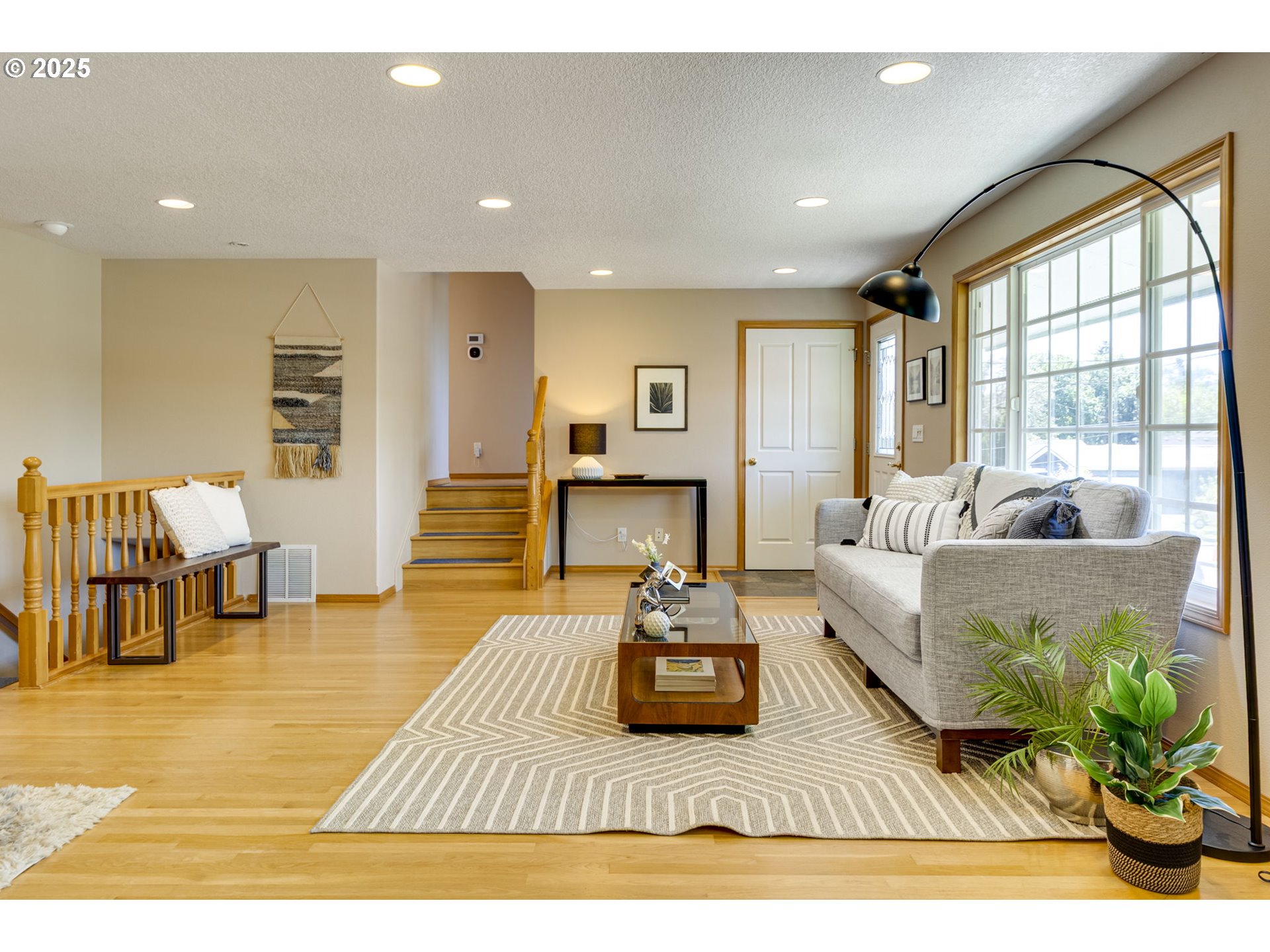 985 Cornell Avenue Gladstone, OR 97027 - Photo 10 of 38 a living room with furniture and a fireplace