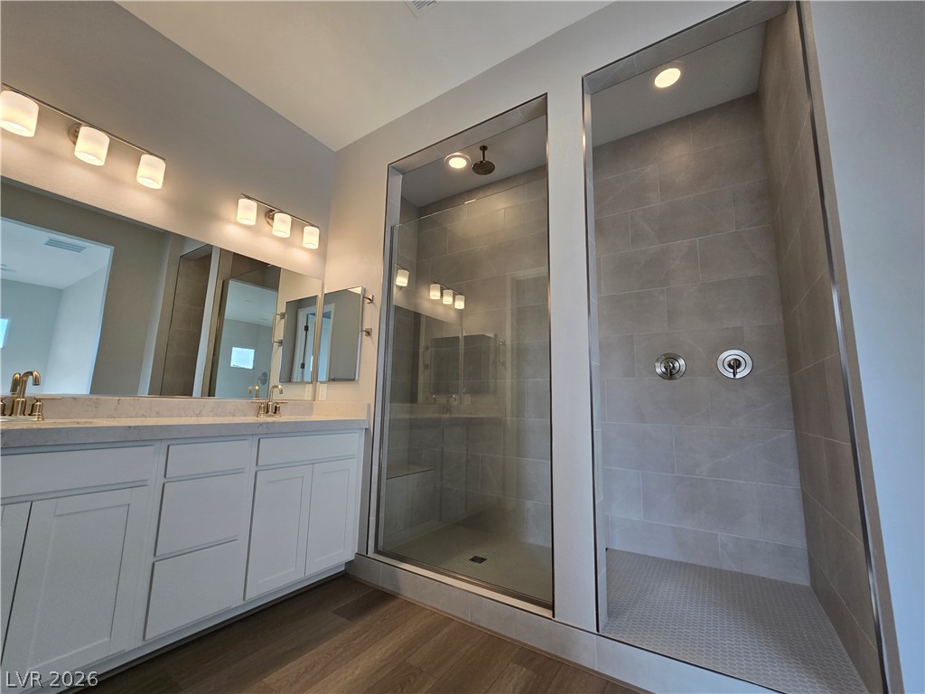 852 Weston Ridge Street Henderson, NV 89011 - Photo 19 of 28 Luxurious double shower and expansive vanity create a spa-like retreat.