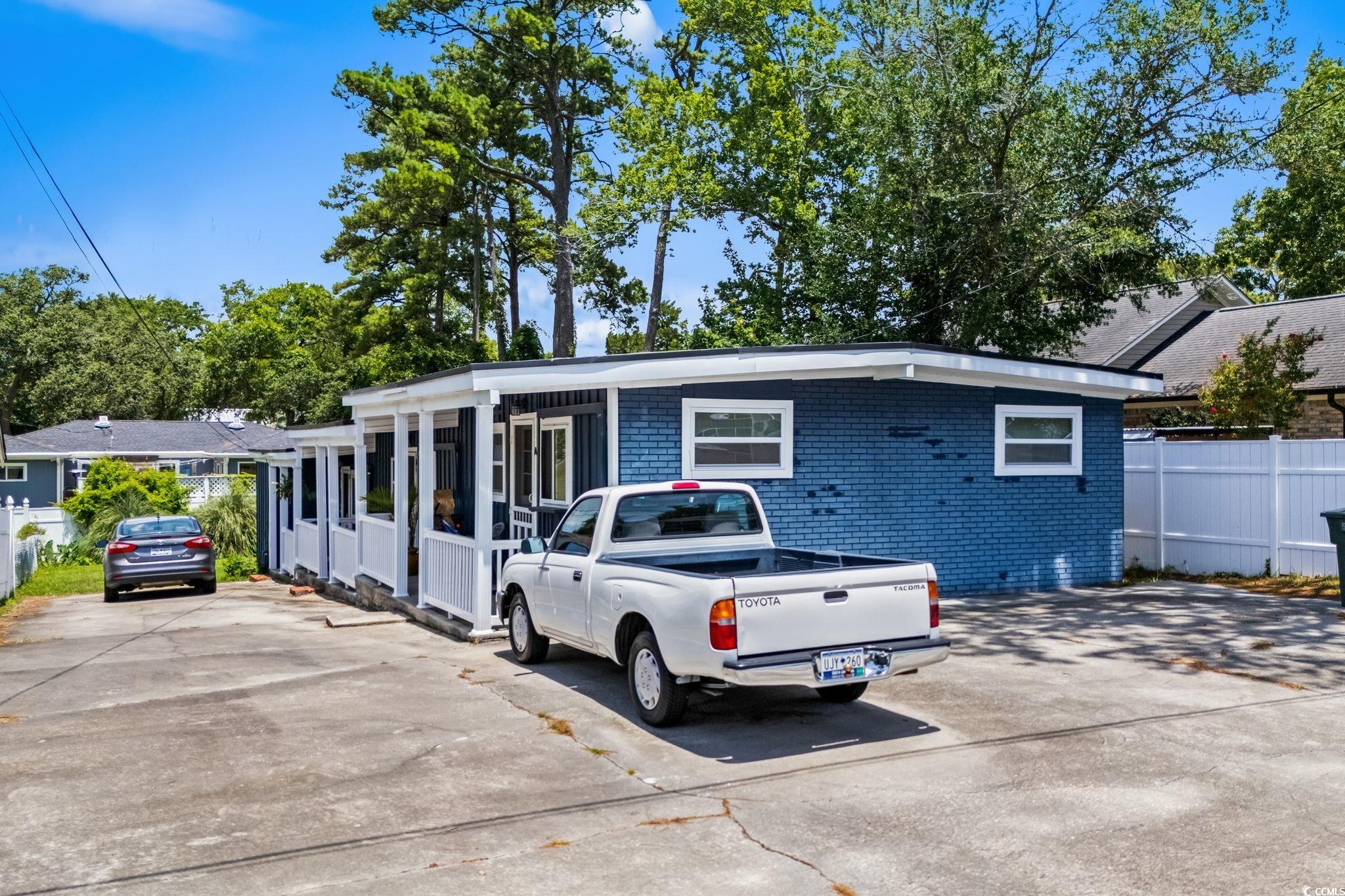 View of front of house with brick siding