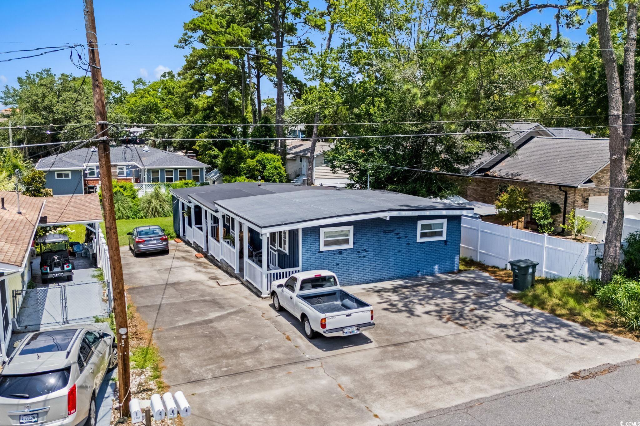3402 Turner Street North Myrtle Beach, SC 29582 - Photo 14 of 26 View of front of house with brick siding and concrete driveway