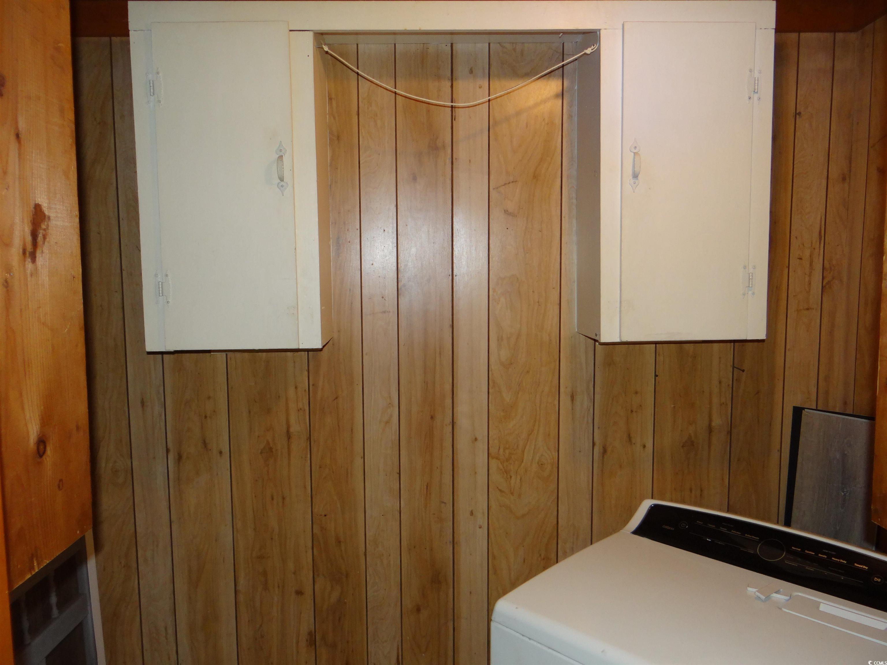 3402 Turner Street North Myrtle Beach, SC 29582 - Photo 24 of 26 Laundry area featuring wood walls and washer / dryer