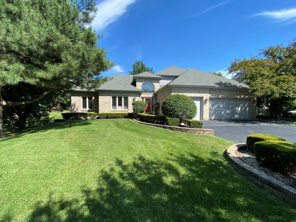 1681 Harris Drive Aurora, IL 60502 - Photo 1 of 1 a front view of a house with a yard table and chairs