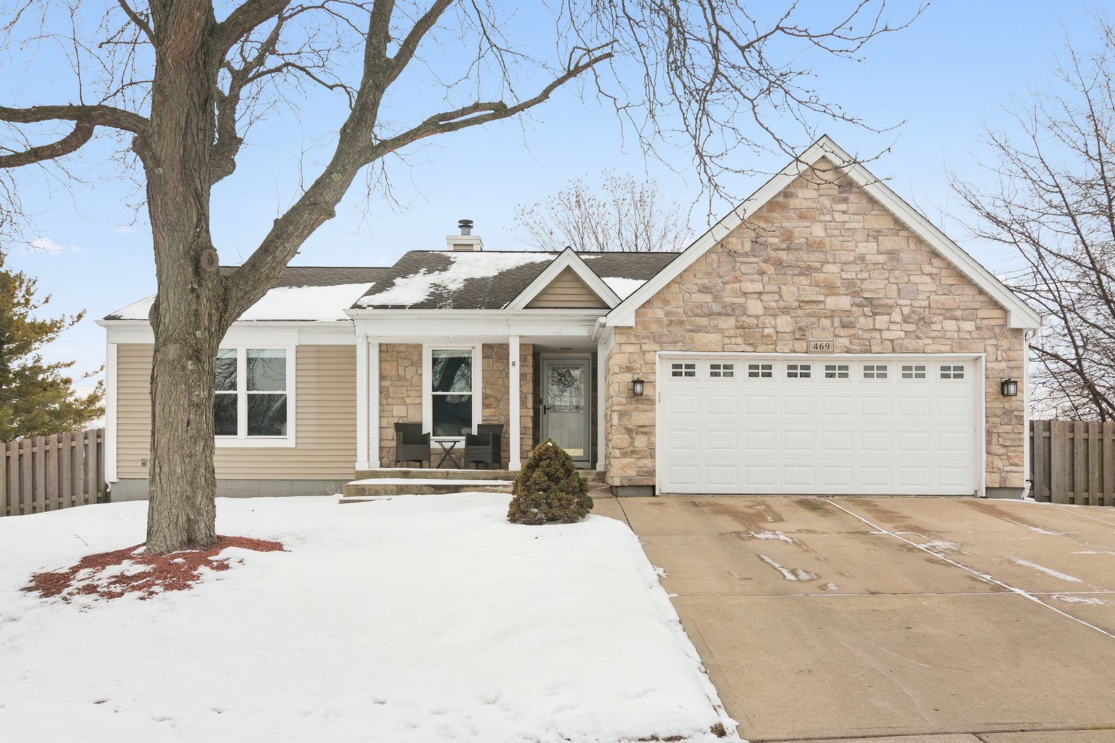 469 Pheasant Ridge Road Lake Zurich, IL 60047 - Photo 1 of 20 a front view of a house with a yard and garage