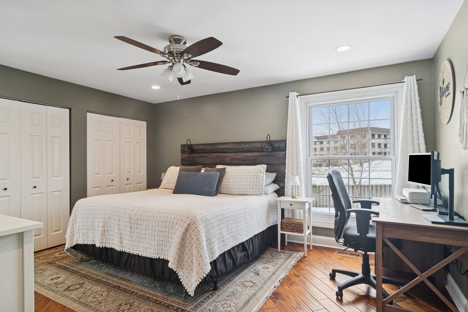 469 Pheasant Ridge Road Lake Zurich, IL 60047 - Photo 16 of 20 a bedroom with a bed and a desk