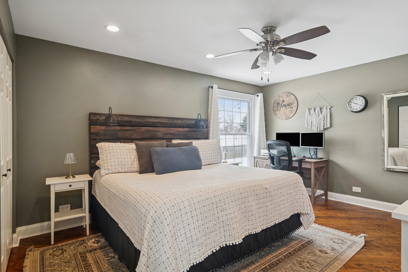 469 Pheasant Ridge Road Lake Zurich, IL 60047 - Photo 17 of 20 a bedroom with a large bed and a chandelier