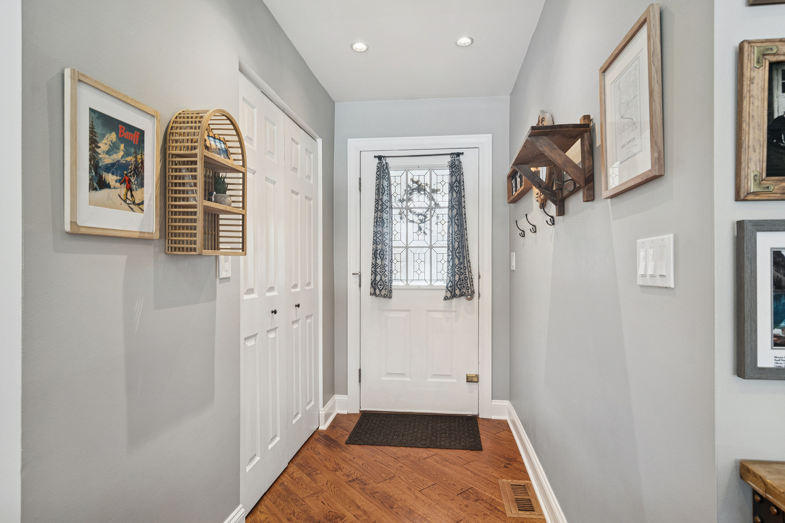 469 Pheasant Ridge Road Lake Zurich, IL 60047 - Photo 3 of 20 a view of hallway with windows and wooden floor