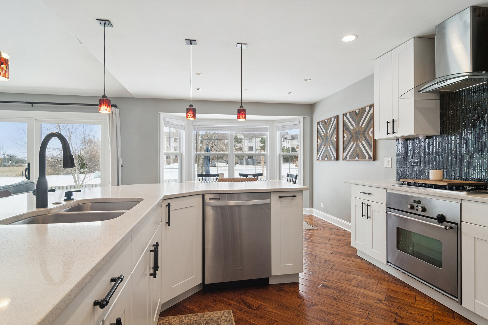 469 Pheasant Ridge Road Lake Zurich, IL 60047 - Photo 5 of 20 a kitchen with stainless steel appliances granite countertop a sink a stove a refrigerator and a oven with wooden floor