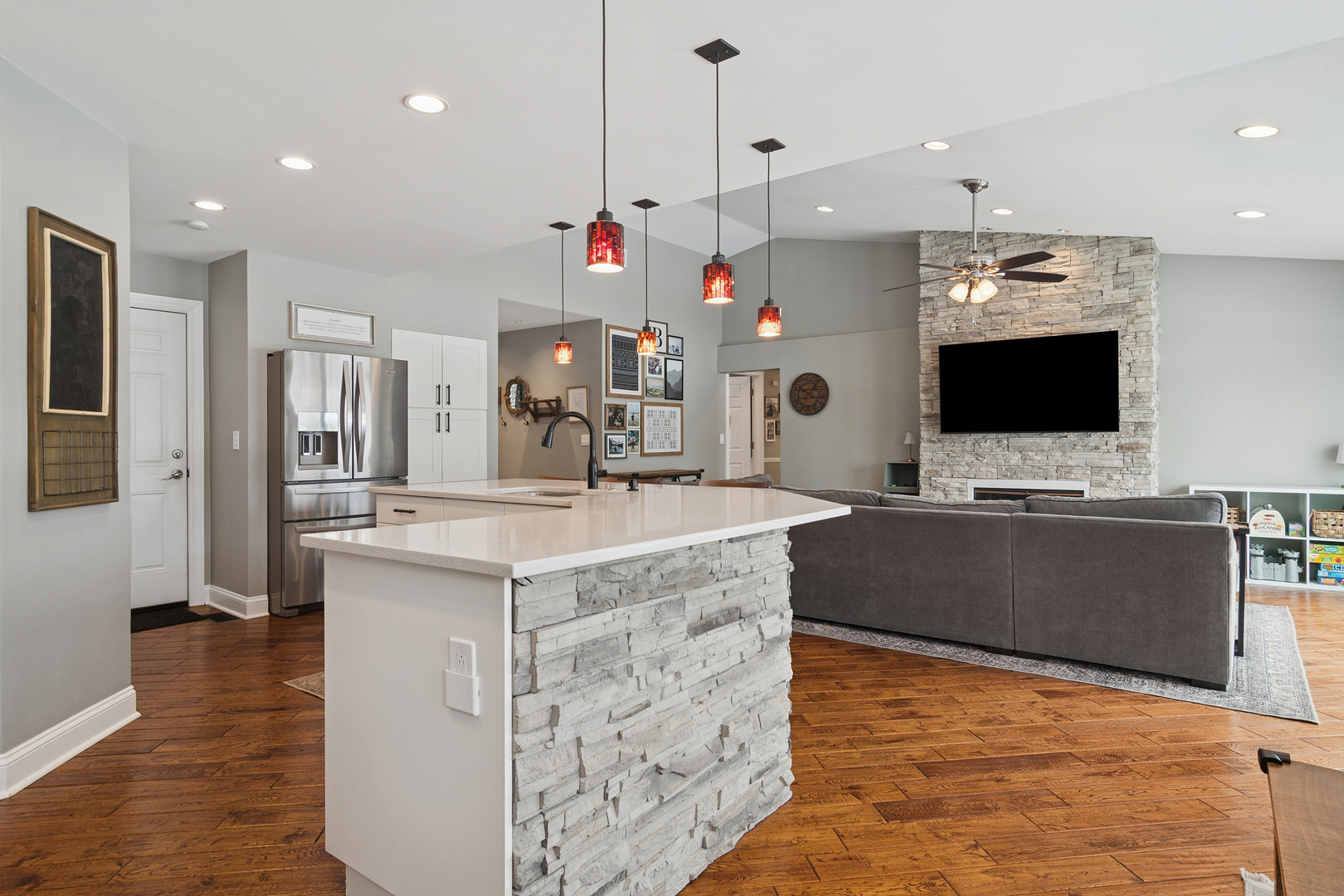 469 Pheasant Ridge Road Lake Zurich, IL 60047 - Photo 6 of 20 a kitchen with kitchen island granite countertop a sink and a stove with wooden floor