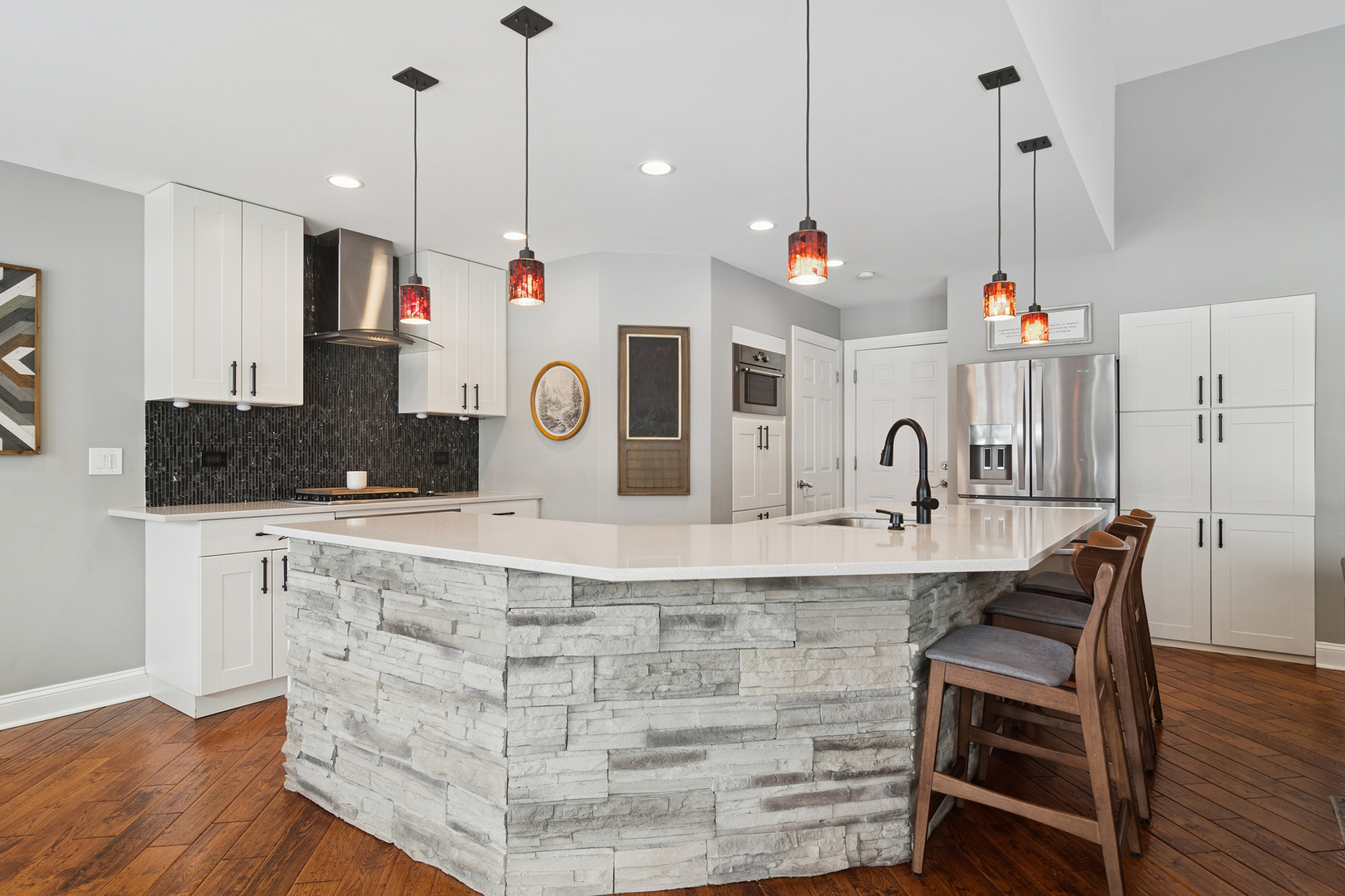 469 Pheasant Ridge Road Lake Zurich, IL 60047 - Photo 7 of 20 a very nice looking kitchen with granite countertop a stove a sink a refrigerator and white cabinets with wooden floor
