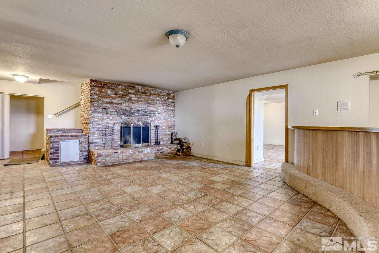 1940 Foothill Road Reno, NV 89511 - Photo 25 of 40 a view of a livingroom with a fireplace and cabinet