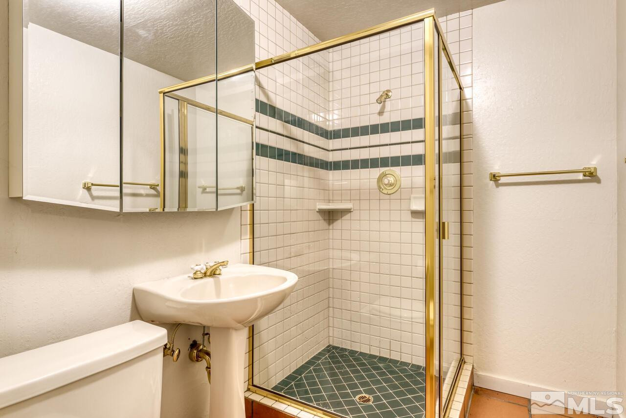 1940 Foothill Road Reno, NV 89511 - Photo 29 of 40 a bathroom with a sink toilet and shower