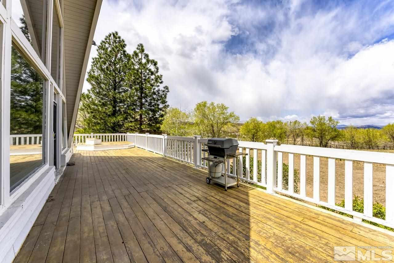 1940 Foothill Road Reno, NV 89511 - Photo 32 of 40 a view of a balcony with wooden floor and bench