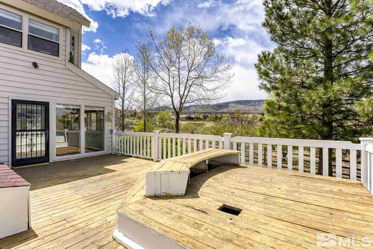 1940 Foothill Road Reno, NV 89511 - Photo 33 of 40 a view of a wooden deck with a bench